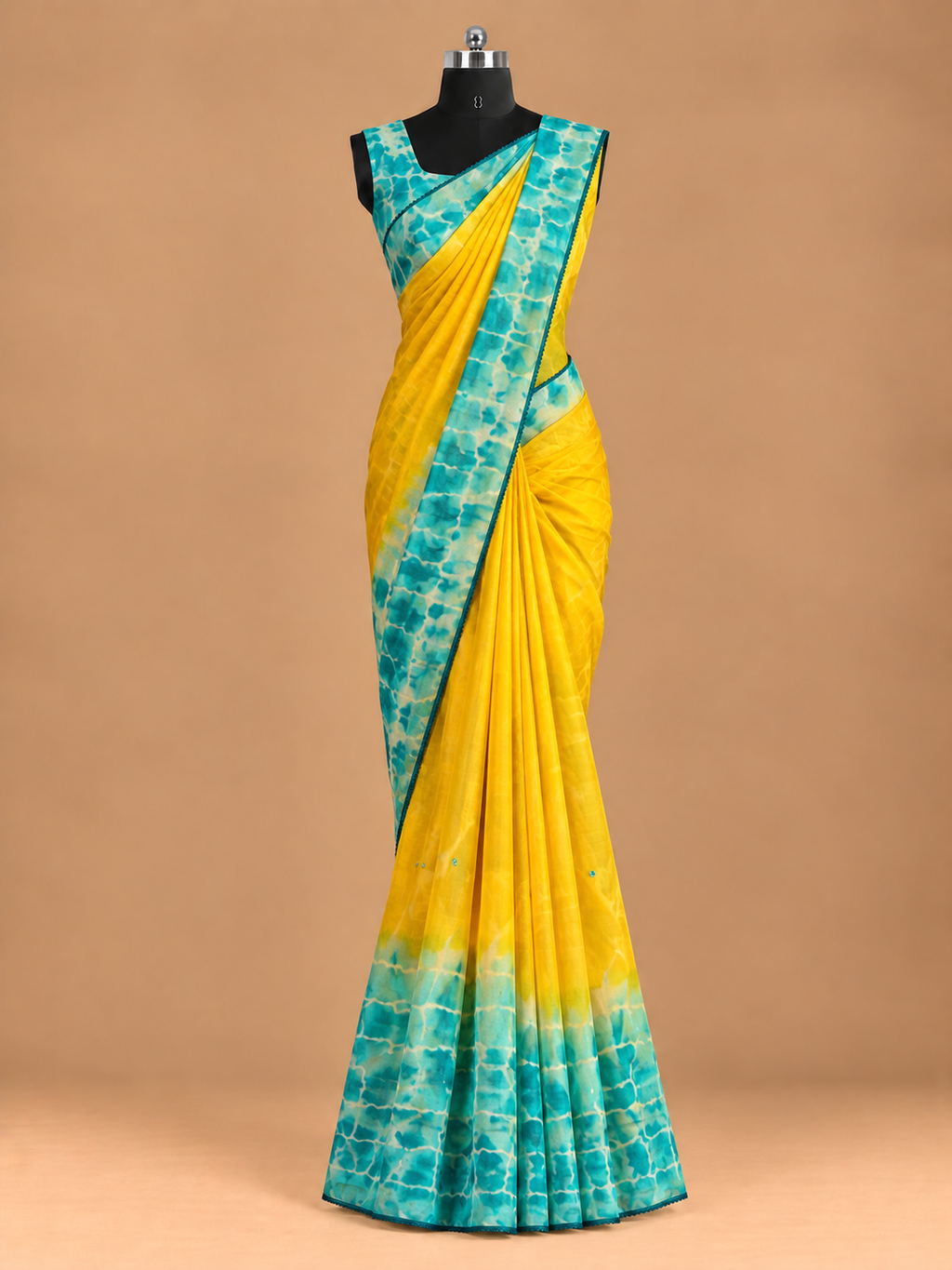 Premium Georgette fabric featuring a beautiful Shibori print and delicate small mirror work.GS080